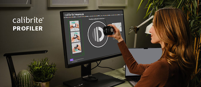 Woman looking at a display colorimeter